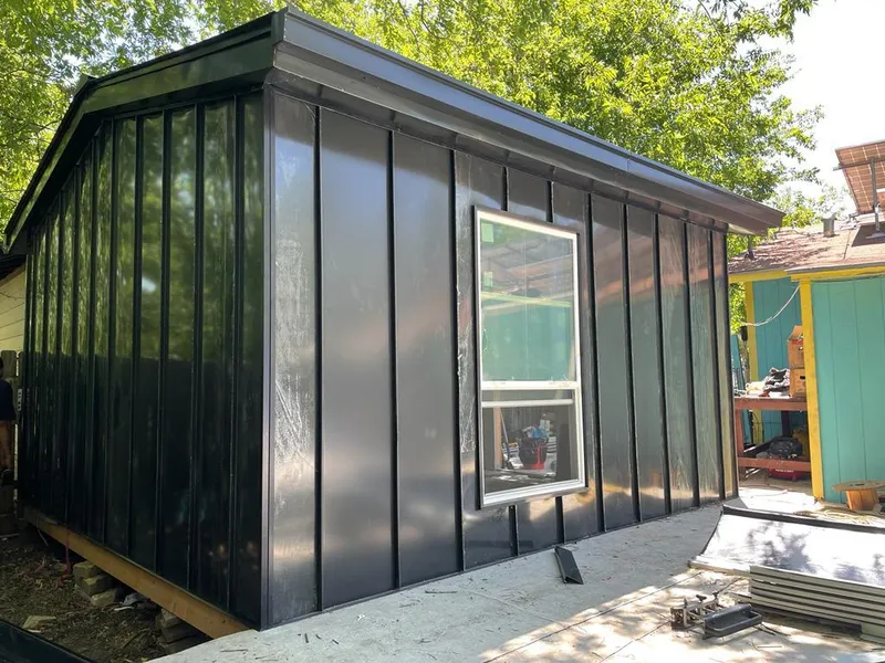 Black standing seam metal wall panels for Roof Inspection in Troy